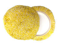 A yellow sponge with a white plate inside of it.