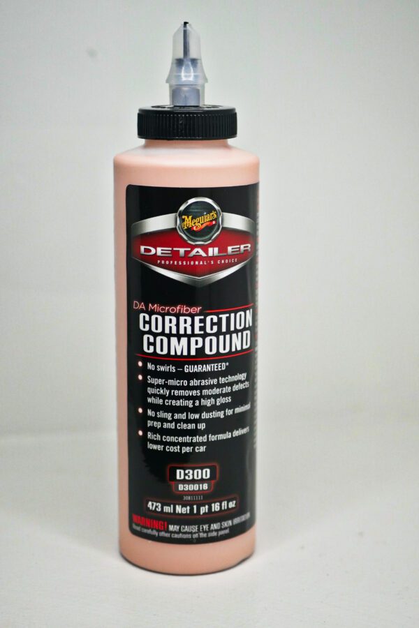 A bottle of correction compound is sitting on the table.
