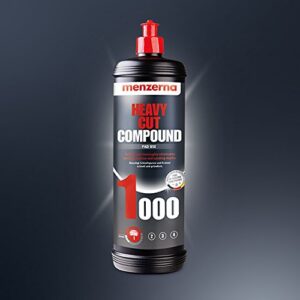A bottle of compound is shown on the ground.