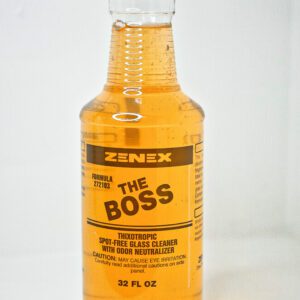 A bottle of the boss is sitting on top of a table.