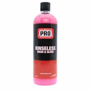 A bottle of pink liquid with the words pro rinseless written on it.